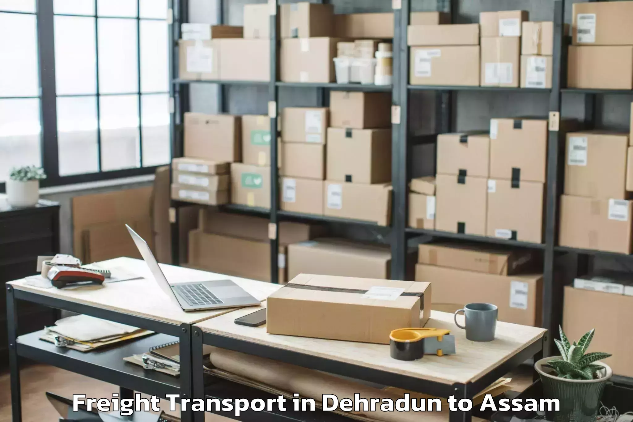 Easy Dehradun to Kharupatia Freight Transport Booking